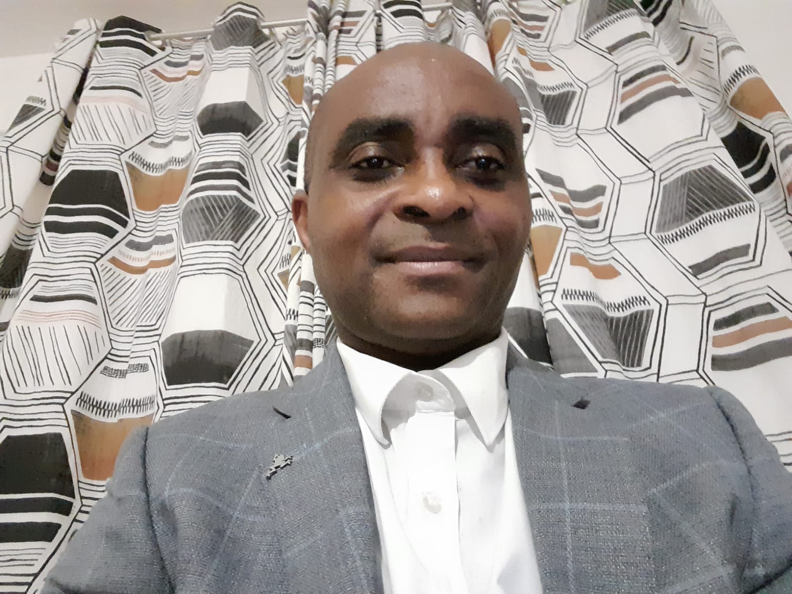 Portrait of Alex Onome Aroh, founder of Onosco Psychotherapy Services